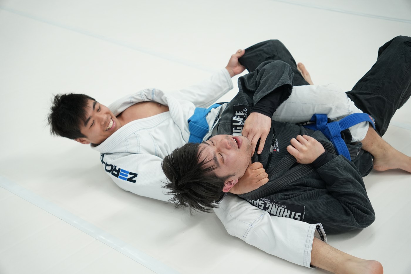 Two training partners laughing during a round